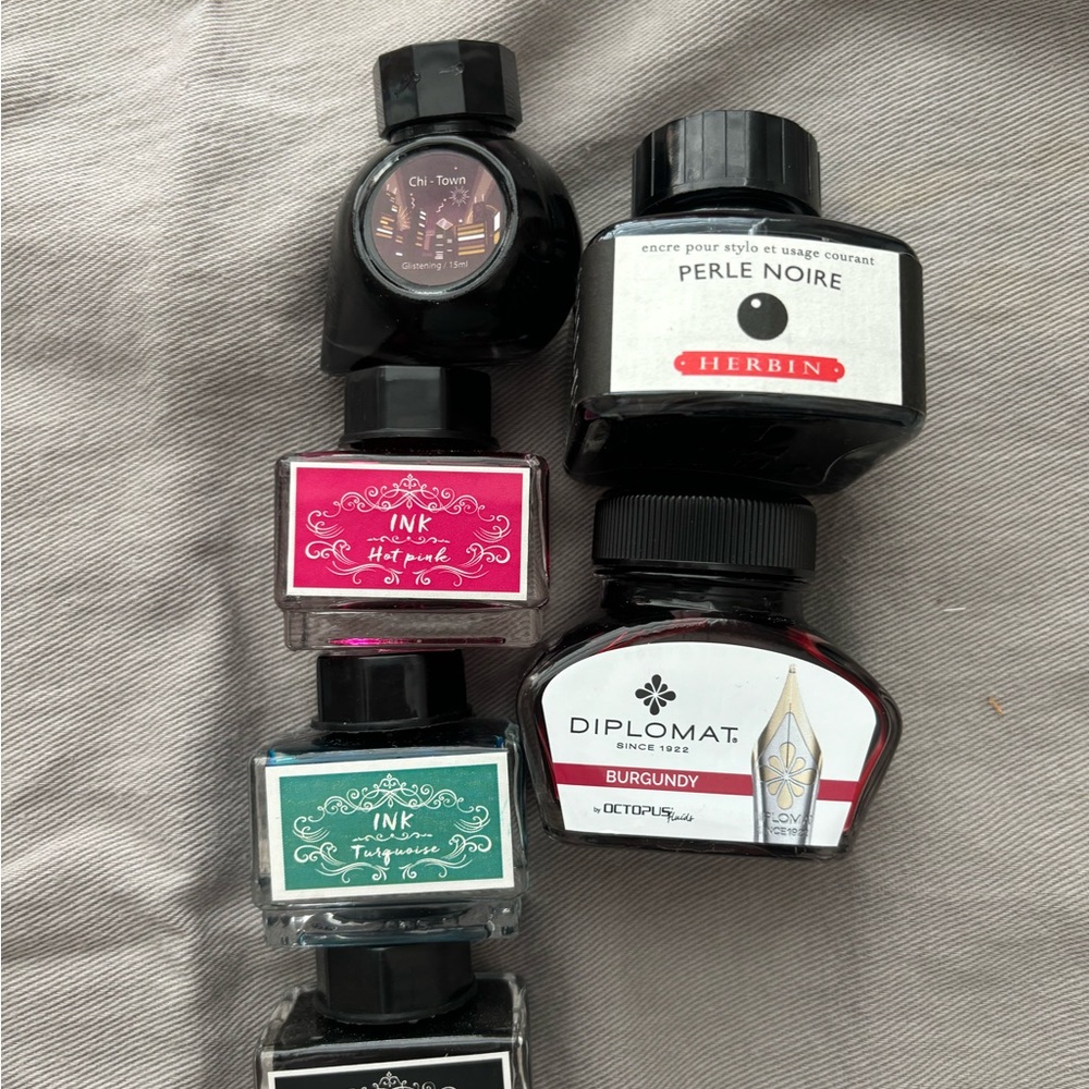 Collection of fountain pen ink including: Herbin, Diplomat, colorverse Chi Town